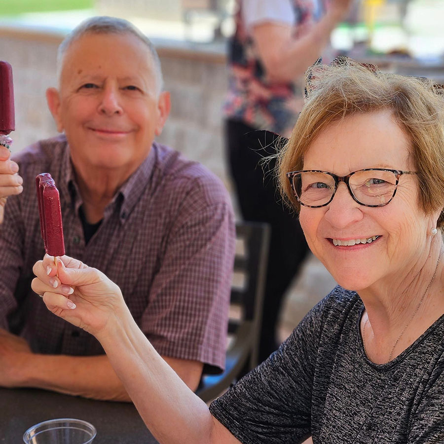 With popsicles in hand, senior residents celebrate National Grape Popsicle Day. The weather couldn't have been more delightful, making it a perfect Memorial Day treat!